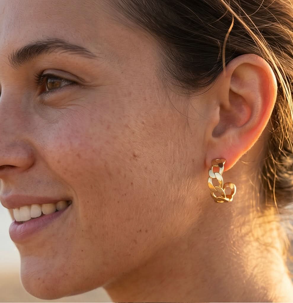 Model wearing Gold Azizi Hoops earrings — waterproof, tarnish-proof jewelry, lifetime color guarantee, Delani Jewelry product photo