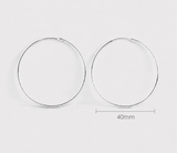 Frankie silver hoop earrings on a light gray background with a measurement label indicating 40mm from Delani Jewelry