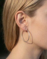 Delani Jewelry's Frankie Hoops silver hoop earrings. Waterproof, tarnish-proof, hypoallergenic earrings backed by a Lifetime Color Guarantee.
