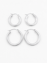 Set of four silver Holly Hoop earrings on a white background for Delani Jewelry