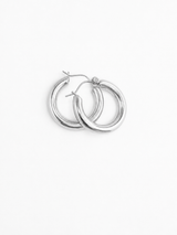 Pair of silver Holly hoop earrings on a white background from Delani Jewelry