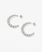 Silver Kendall Hoops by Delani Jewelry featuring sleek, modern jewelry design with polished finish.