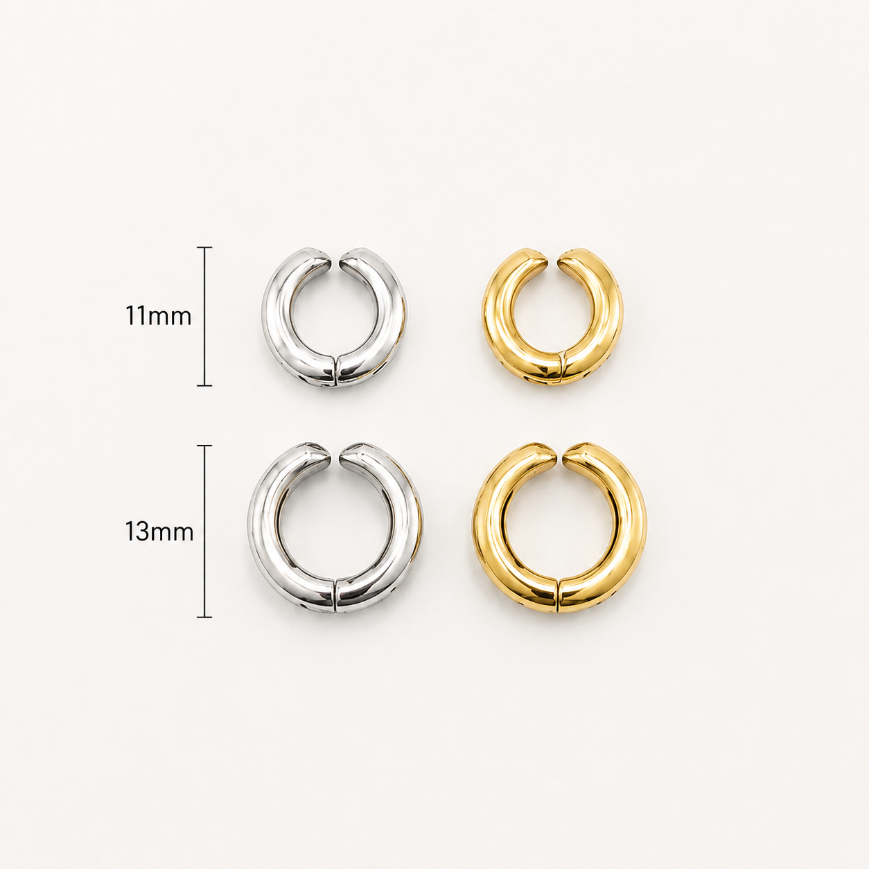 Four small hoop earrings shown on a plain light background, with two silver-toned hoops and two gold-toned hoops arranged in a 11mm and 13mm size layout with measurement markers. Kenza Cuff in gold, product shot showing tarnish-proof waterproof finish with lifetime color guarantee