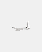 Delani Jewelry silver bar stud earrings with a polished minimalist design, sleek stainless steel earrings for everyday wear and effortless style. Named Namaari Studs
