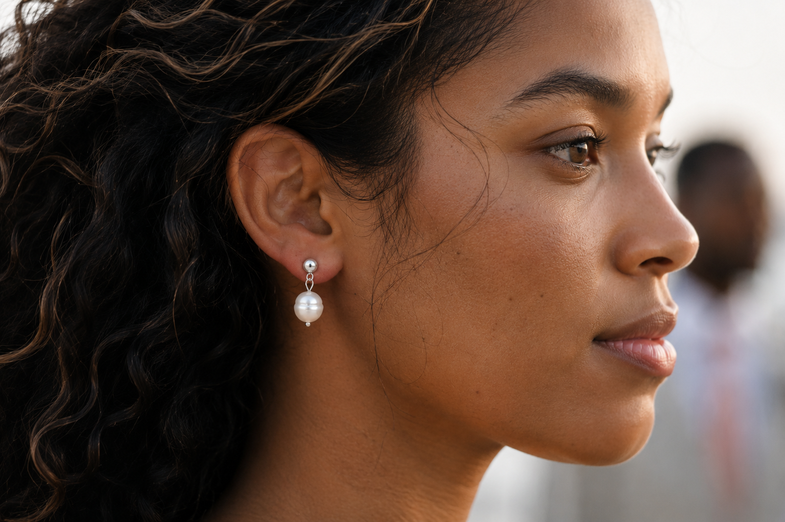 Woman Wearing Delani Jewelry Oma Earrings in Silver – Waterproof & Tarnish-Proof Pearl Drops