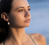 Close-Up of Delani Jewelry Oma Earrings in Gold – Tarnish-Proof, Waterproof Baroque Pearl Drops
