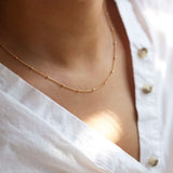 Sofia choker by Delani Jewelry s featuring a delicate, stylish necklace with intricate chain details.
