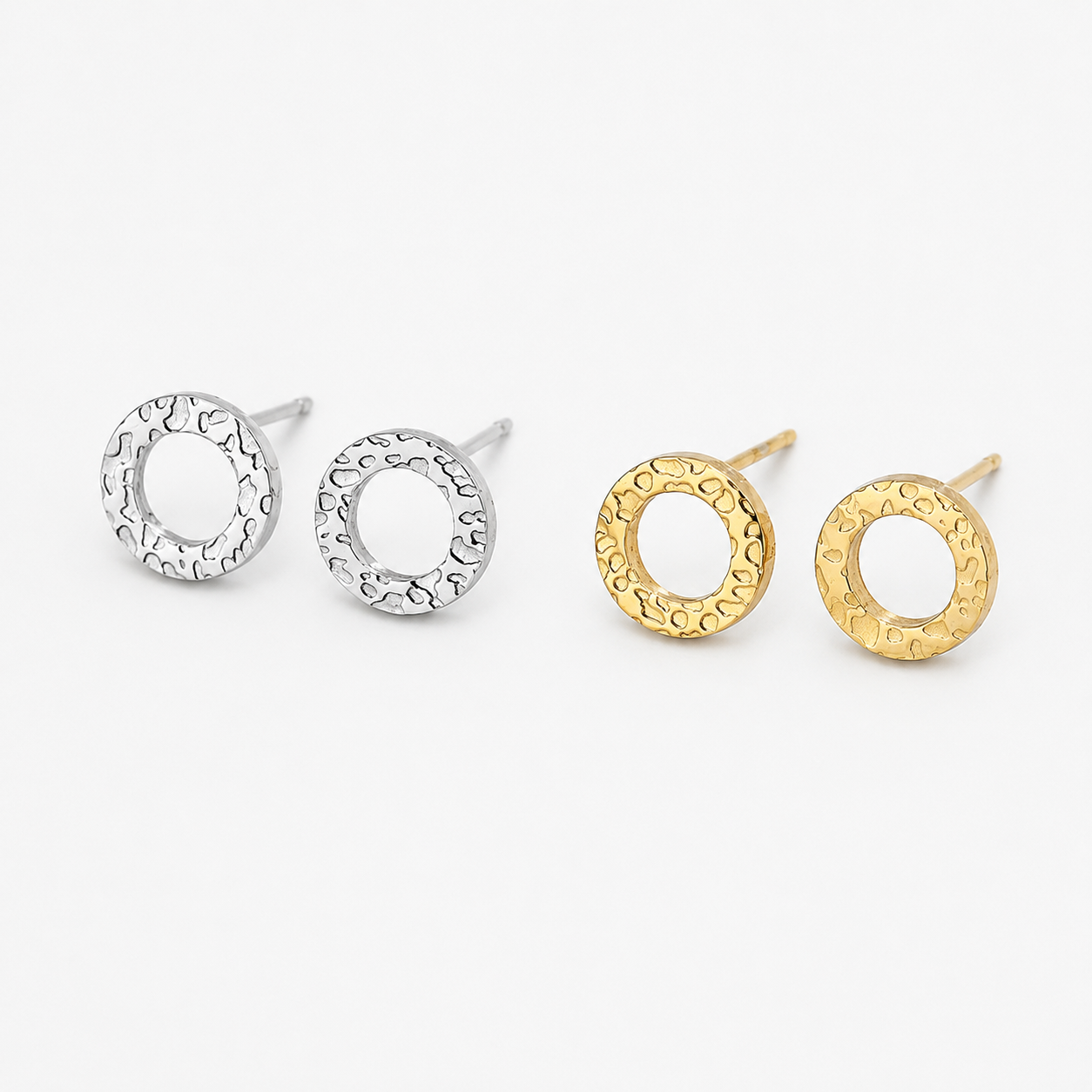 Three textured circular stud earrings on a light gray background, including two silver-toned and one gold-toned pair. Hammered Circle Studs – Waterproof, Tarnish-Proof Beach-Ready Earrings from delani jewelry