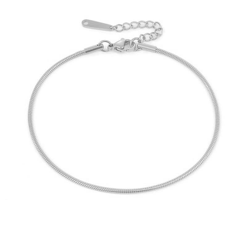 Silver Lyra anklet from Delani Jewelry featuring delicate chain design and adjustable clasp.