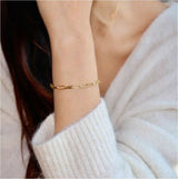 Elegant Alex bracelet from Delani Jewelry featuring intricate jewelry design on a sleek, stylish piece of jewelry.