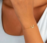 Delani Jewelry Daphne bracelet featuring elegant design with delicate chain and charm for stylish jewelry accessories.