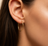 Delani Jewelry's Frankie Hoops gold  earrings. Waterproof, tarnish-proof, hypoallergenic earrings backed by a Lifetime Color Guarantee.