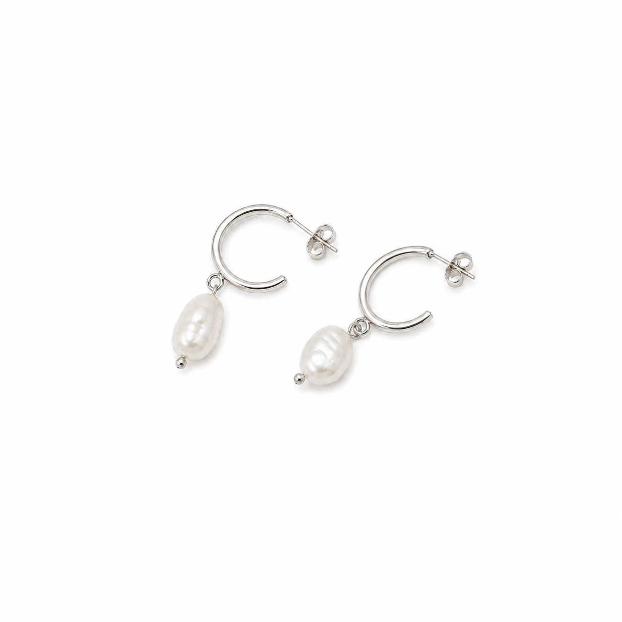 Delani Jewelry's Pola Hoops silver freshwater pearl drop hoop earrings with organic baroque pearls. Waterproof, tarnish-proof, hypoallergenic earrings backed by a Lifetime Color Guarantee.