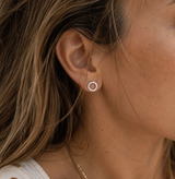 Woman Wearing Silver Hammered Circle Stud Earrings – Waterproof, Tarnish-Proof Everyday Jewelry from delani jewelry